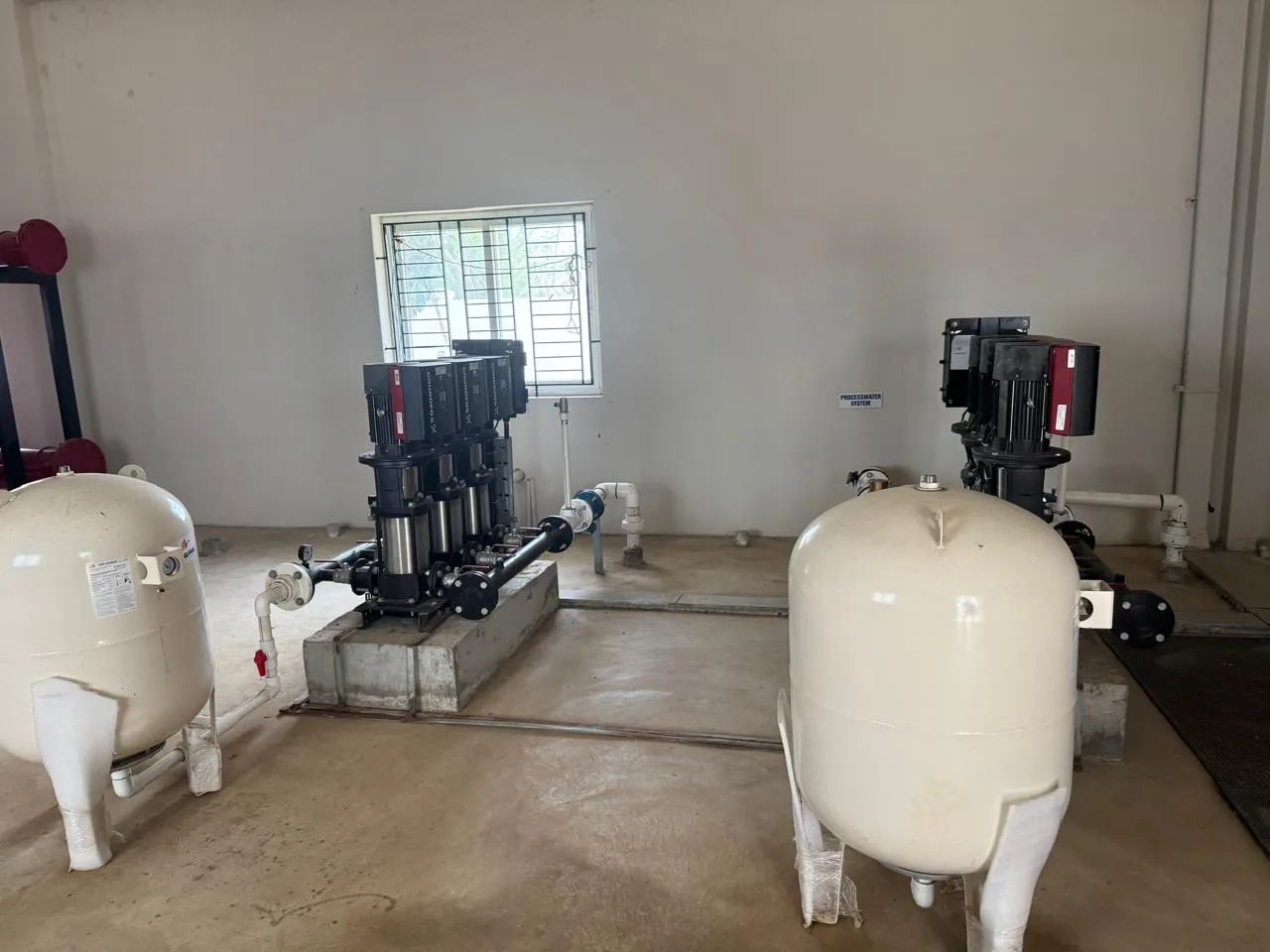 Vertical multistage booster pumps and pressure vessels in the utility pump room at Kuibyshev Azot