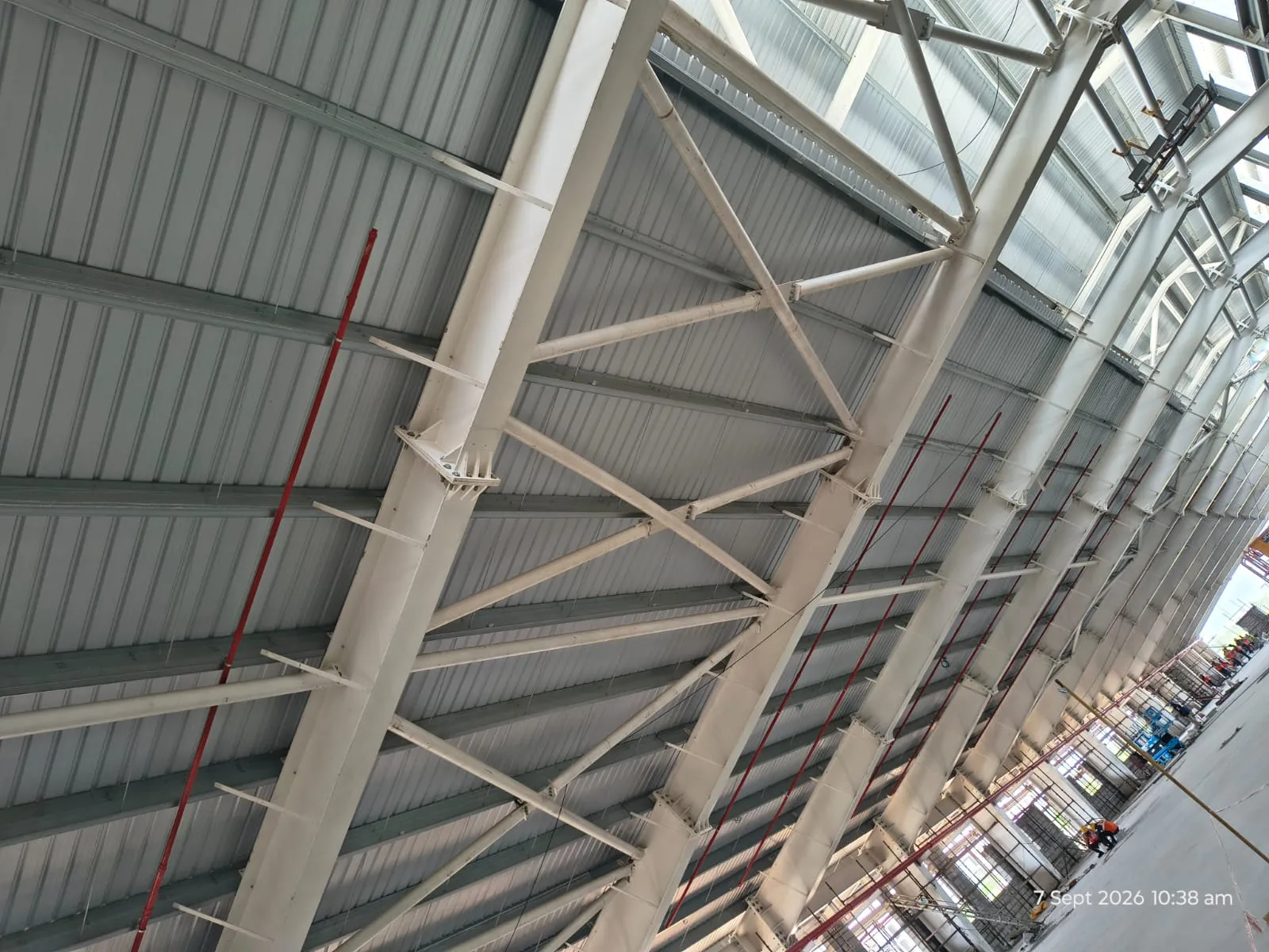 A sprinkler branch line carried along a roof truss at a Pou Chen building