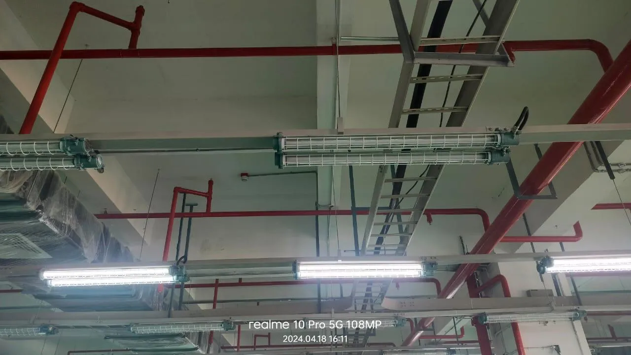 Sprinkler pipework, cable tray and lighting coordinated at the Foxconn ceiling