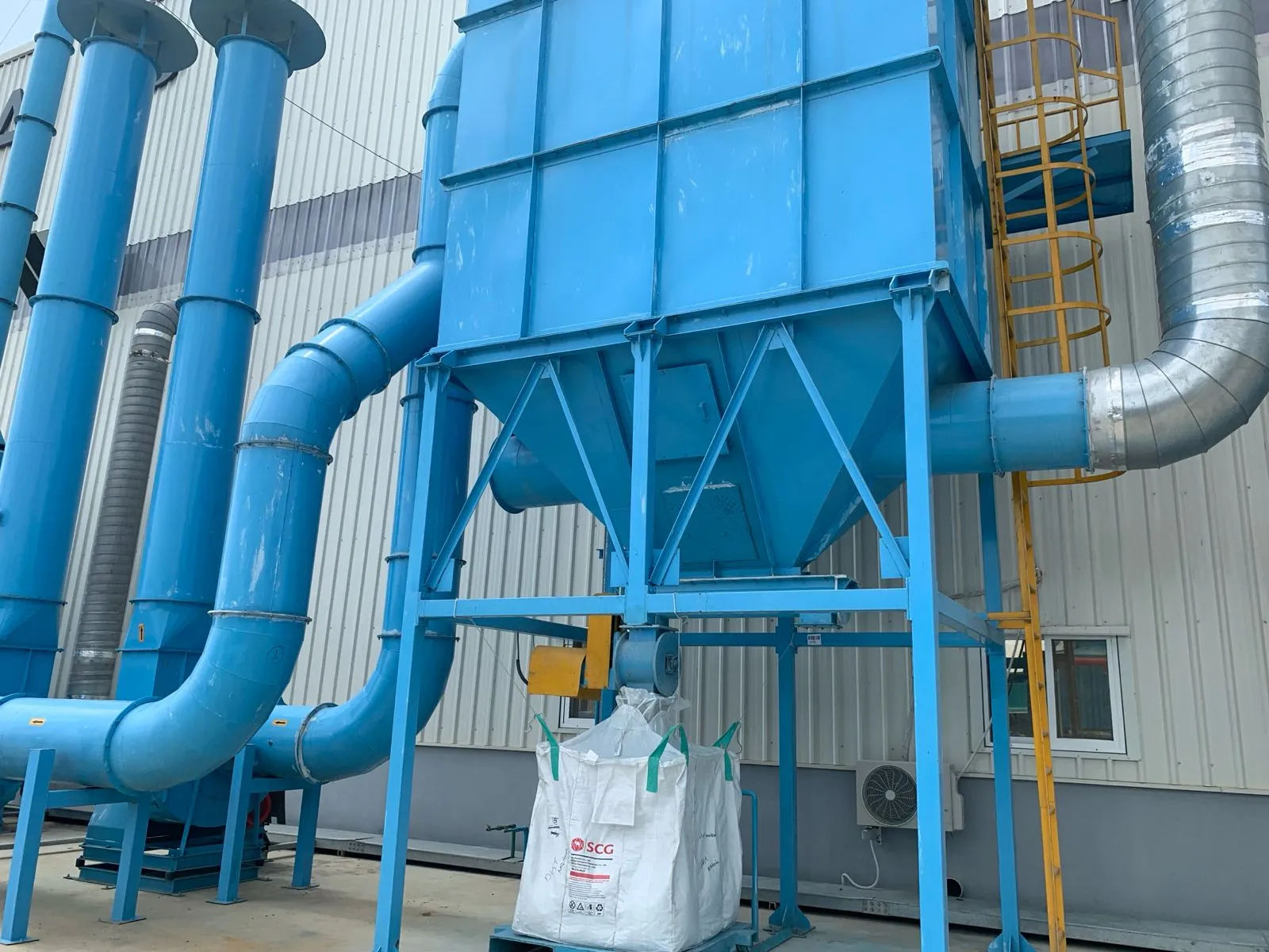 Dust collector and extraction ductwork outside the Kuibyshev Azot plant building