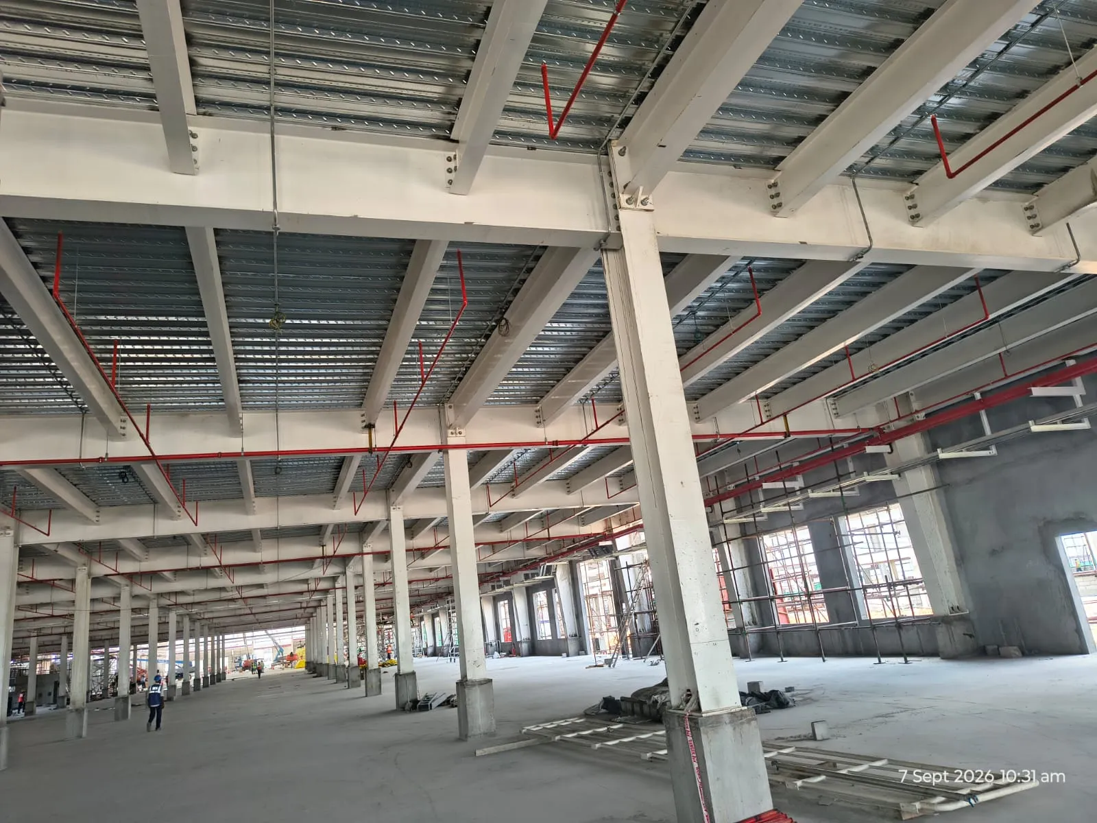 Sprinkler mains and drops between the columns of a Pou Chen hall