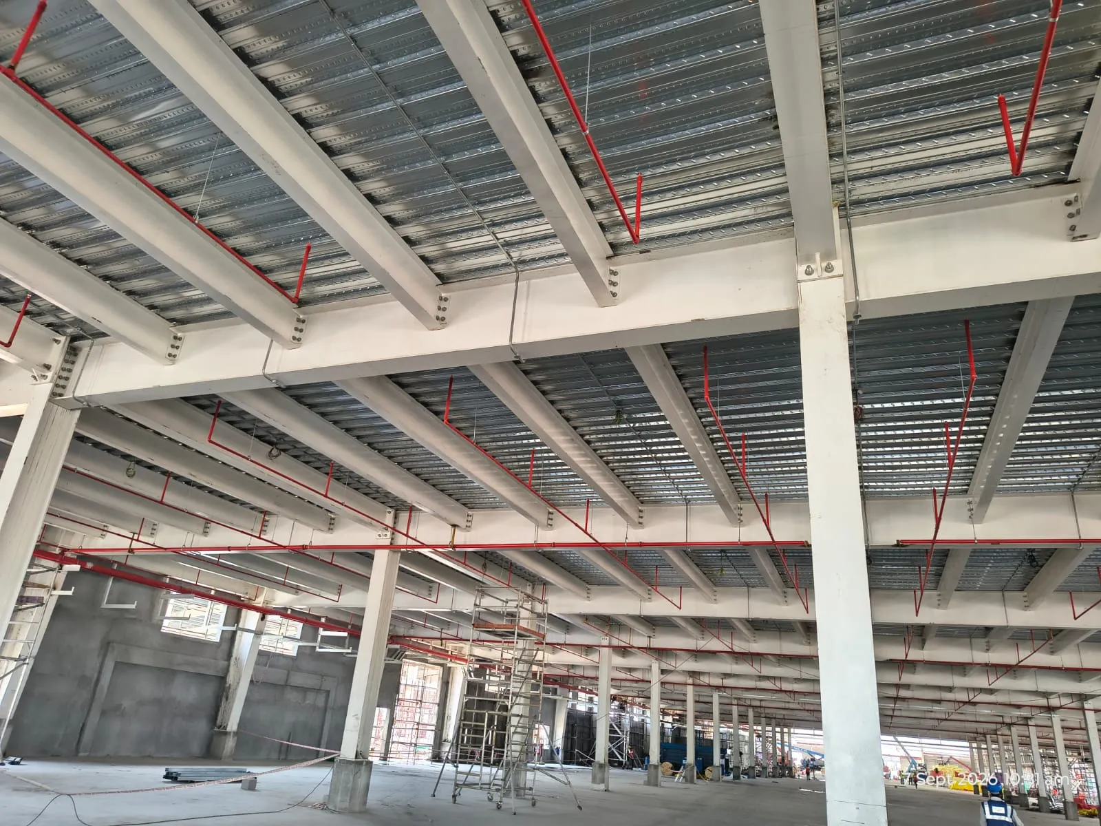 Sprinkler main and drops following the beam line across a Pou Chen floor