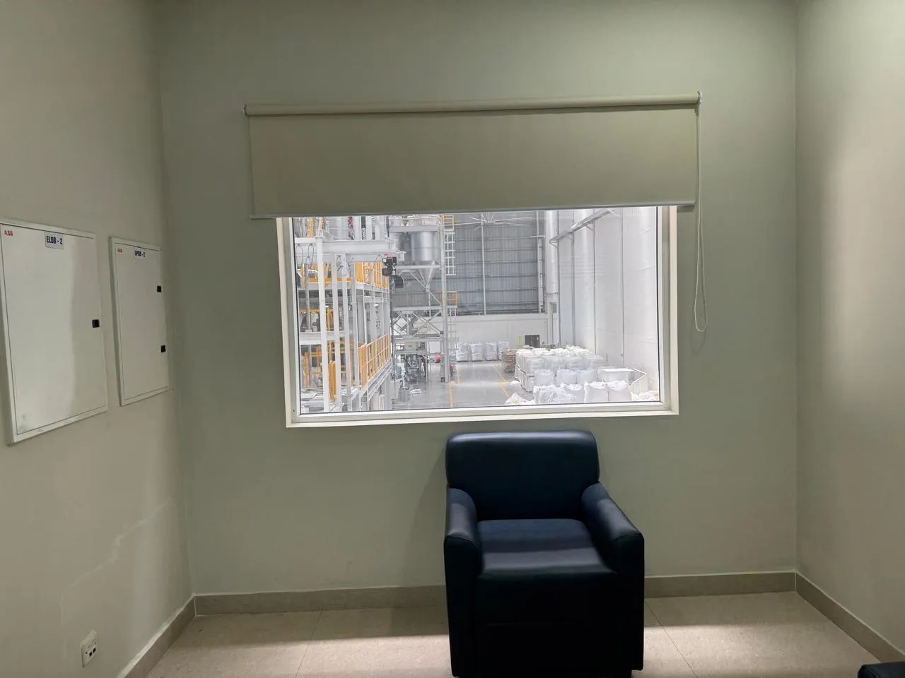 Small meeting room at Kuibyshev Azot, its window looking onto the plant floor