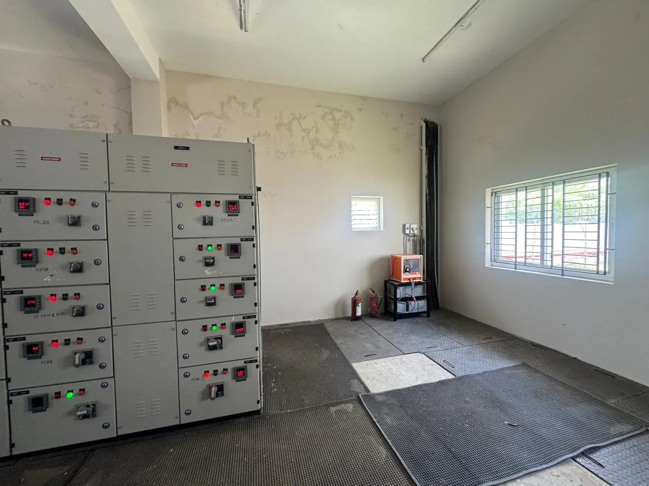 Electrical panel room with wall-mounted extinguishers at Kuibyshev Azot