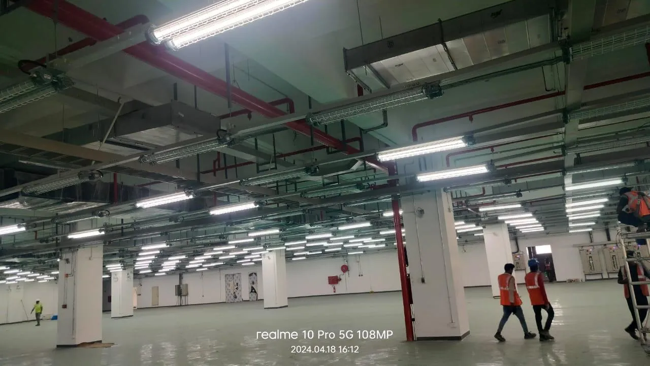 Foxconn production floor at handover, with hose cabinets along the columns