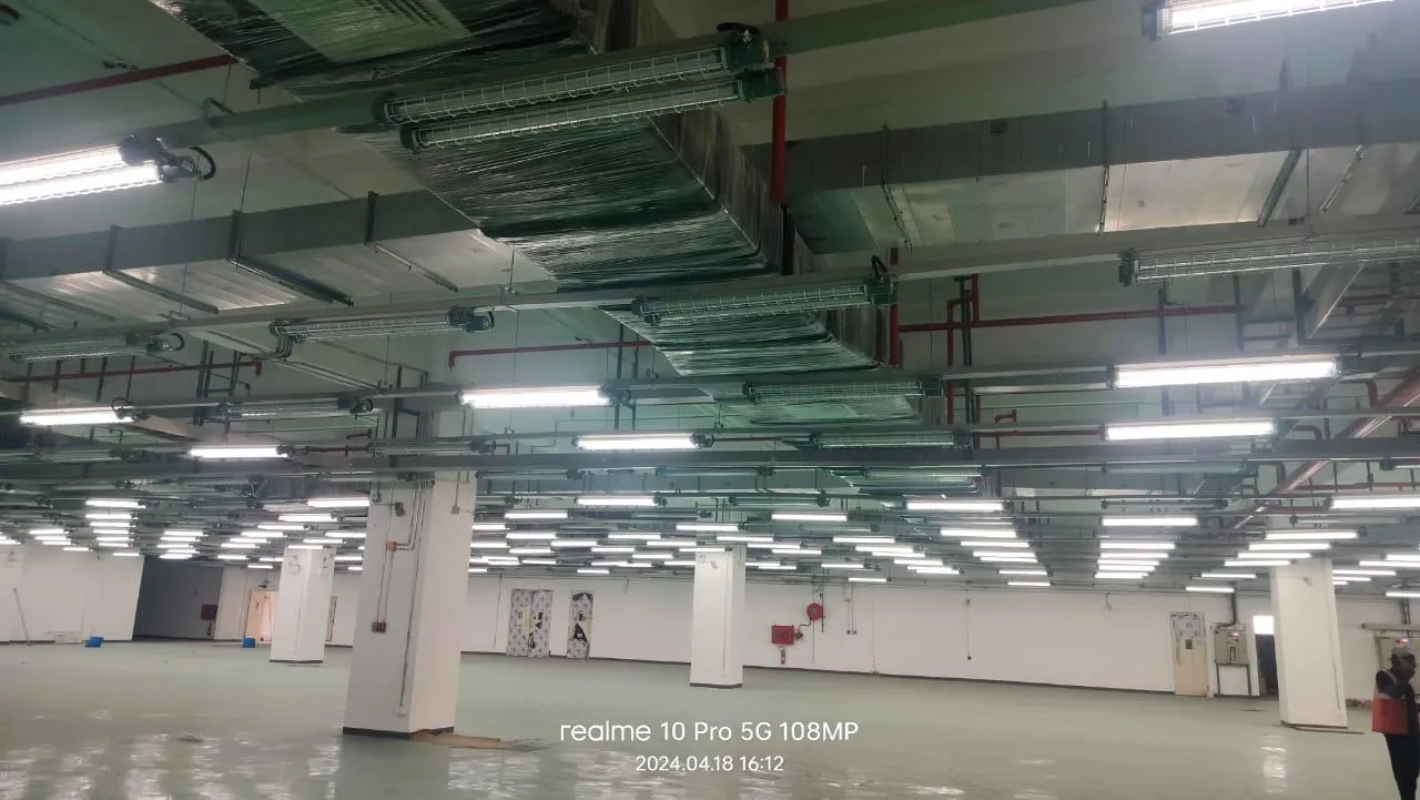 Wide view of a completed Foxconn production floor with the fire-protection pipework overhead