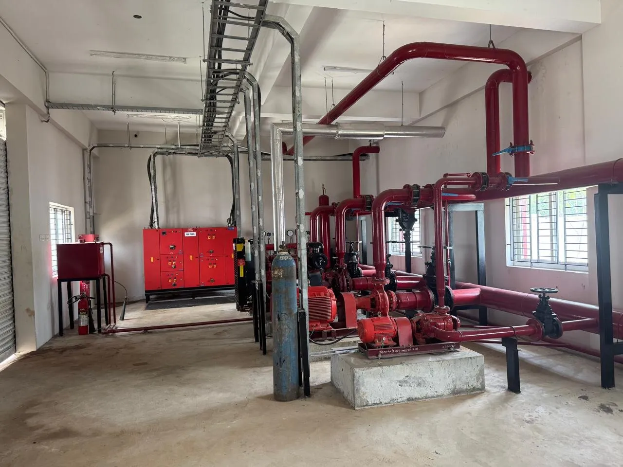 Fire pump set with painted headers and valves in the Kuibyshev Azot pump room