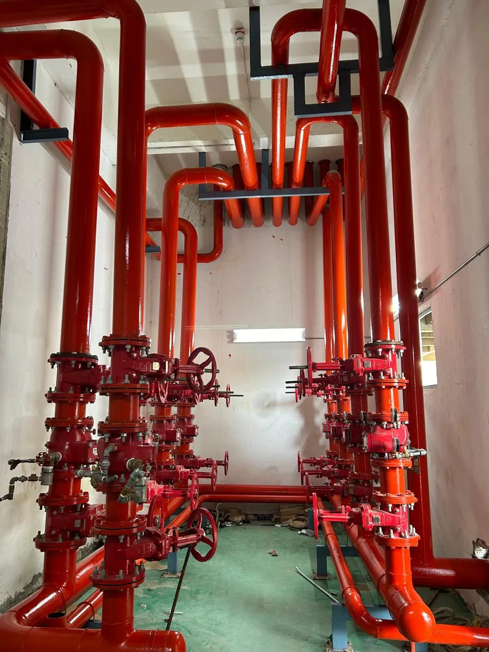 Installation control valve set and riser pipework painted red at Foxconn