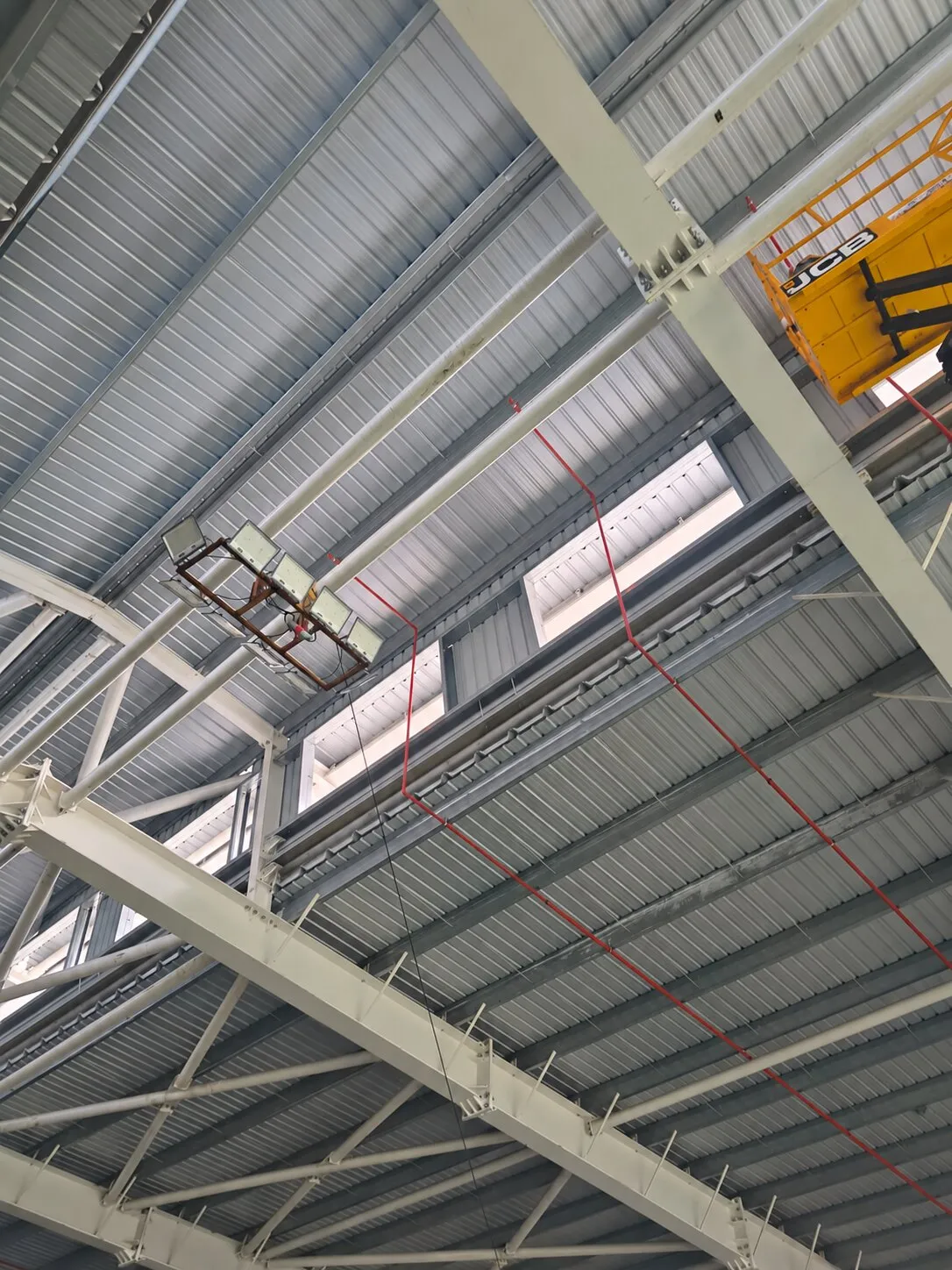 Sprinkler branch lines following the roof structure at a Pou Chen building