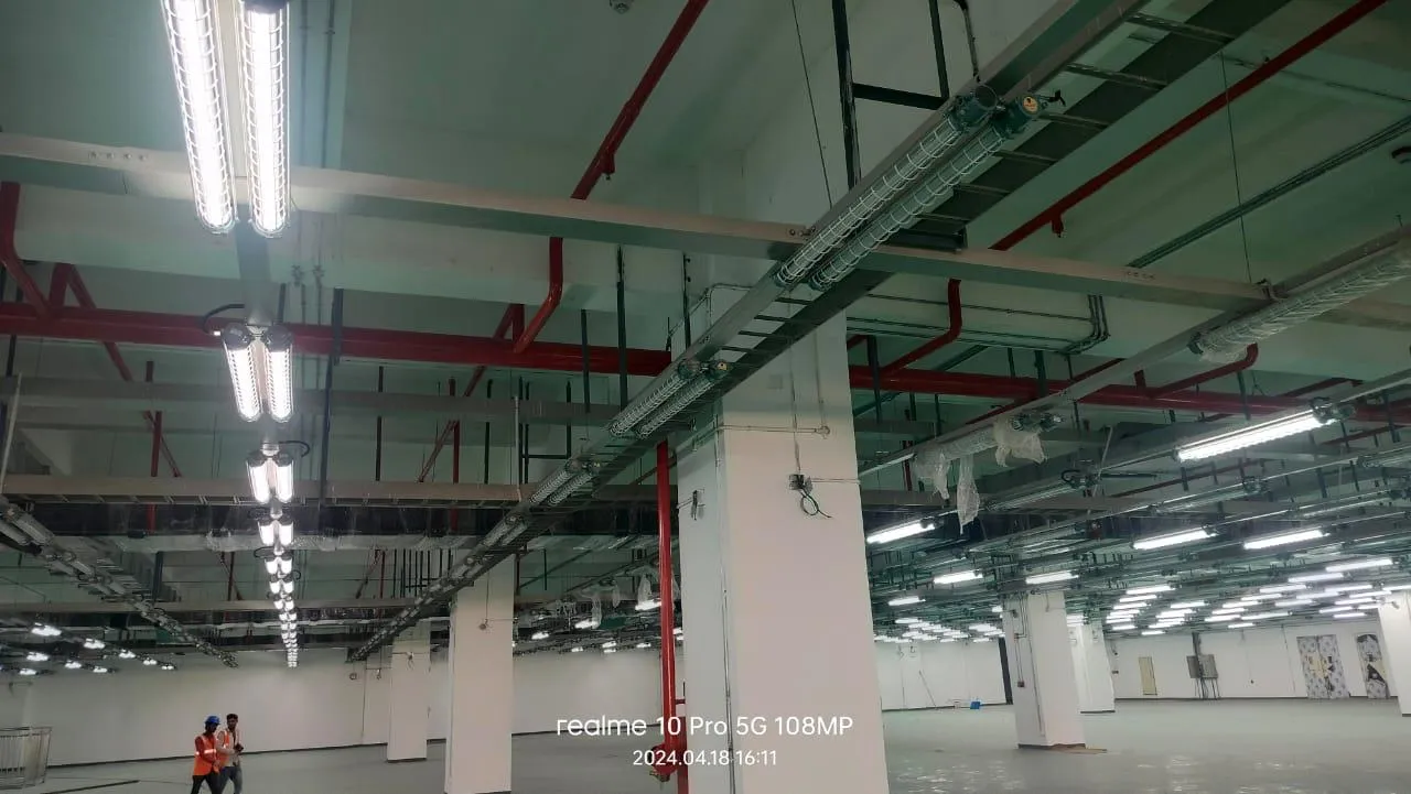 Sprinkler main and branch lines against the soffit of a Foxconn production floor