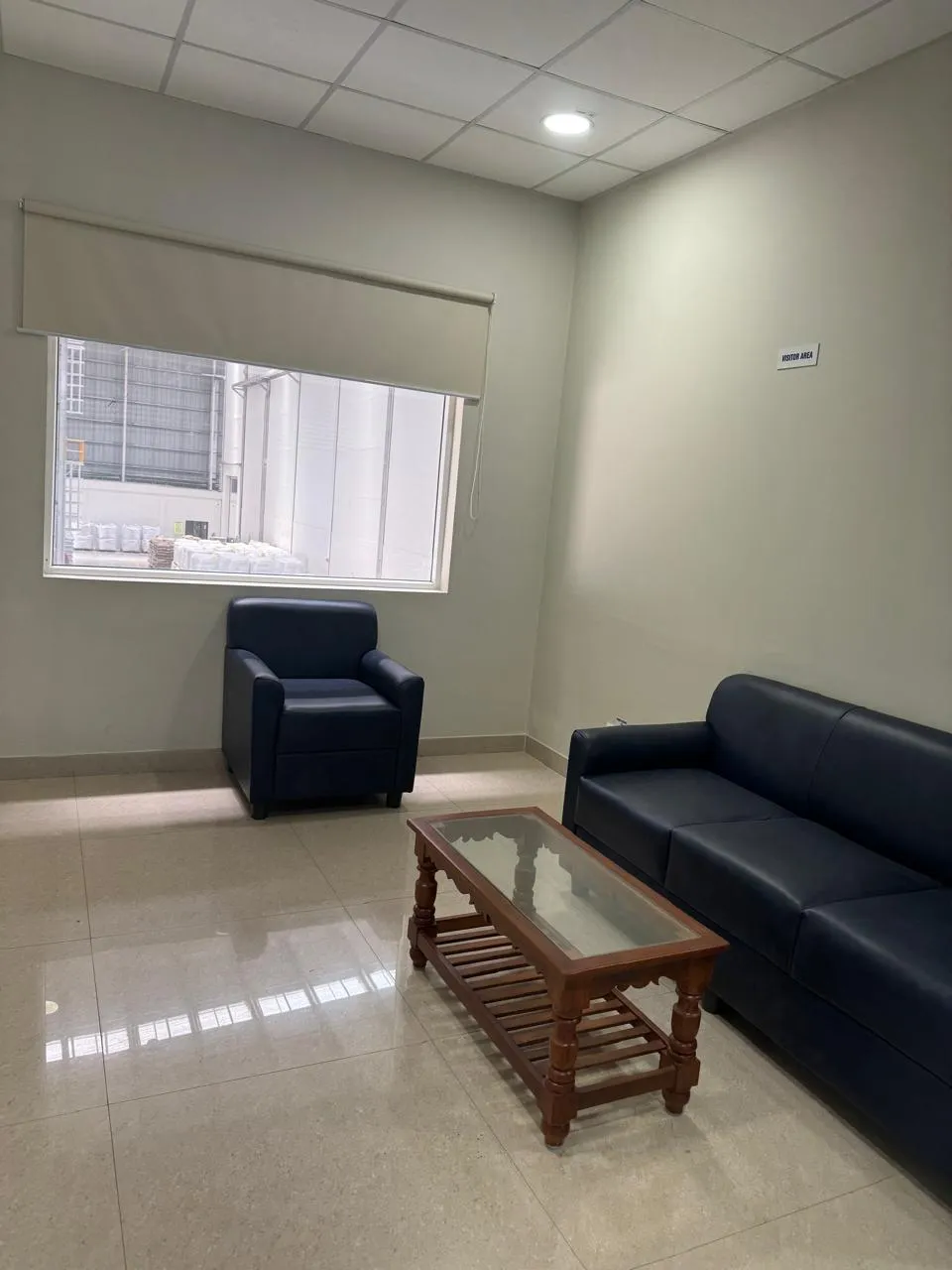 Waiting room with sofa and low table in the Kuibyshev Azot office block