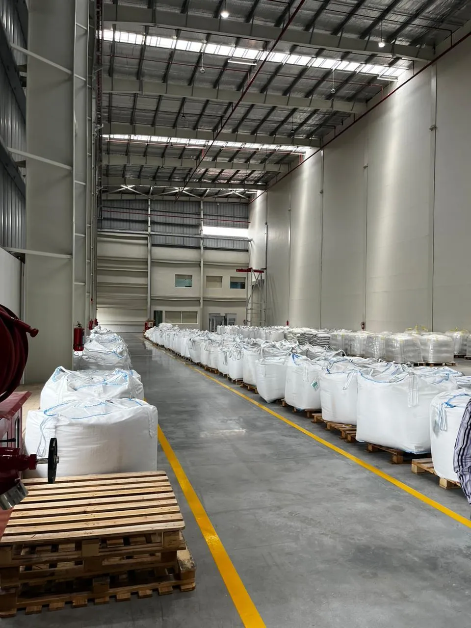 Hose reel and extinguisher at the head of the bulk-bag storage aisle at Kuibyshev Azot